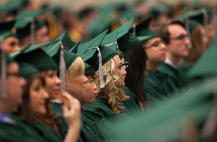 Photograph of graduates seated at a convocation ceremony.